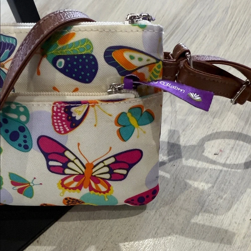 Lily Bloom Cream Crossbody Bag with Multicolor Butterfly Print and Brown Trim - Picture 6 of 12
